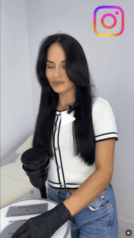 Marcela Cenusa presenting the Vibromatic body contouring machine in her Chisinau studio.